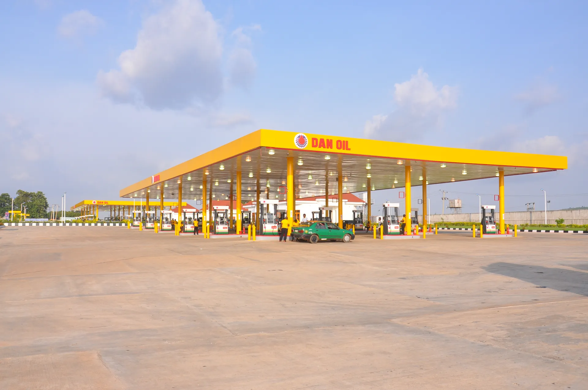 Dan Oil Airport Road mega station, sunlit canopy with vehicle at pump