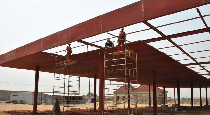 Men at work in the World's Largest Petrol Filling Station of 160 Nozzles.